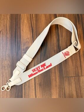 BEIS  Lonely Ghost “Text Me When You Land” beige Travel Bag Strap with Red Text